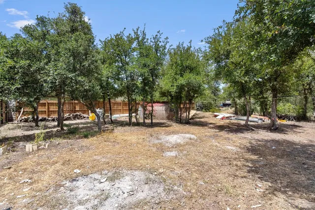 a view of a tree in front of a house