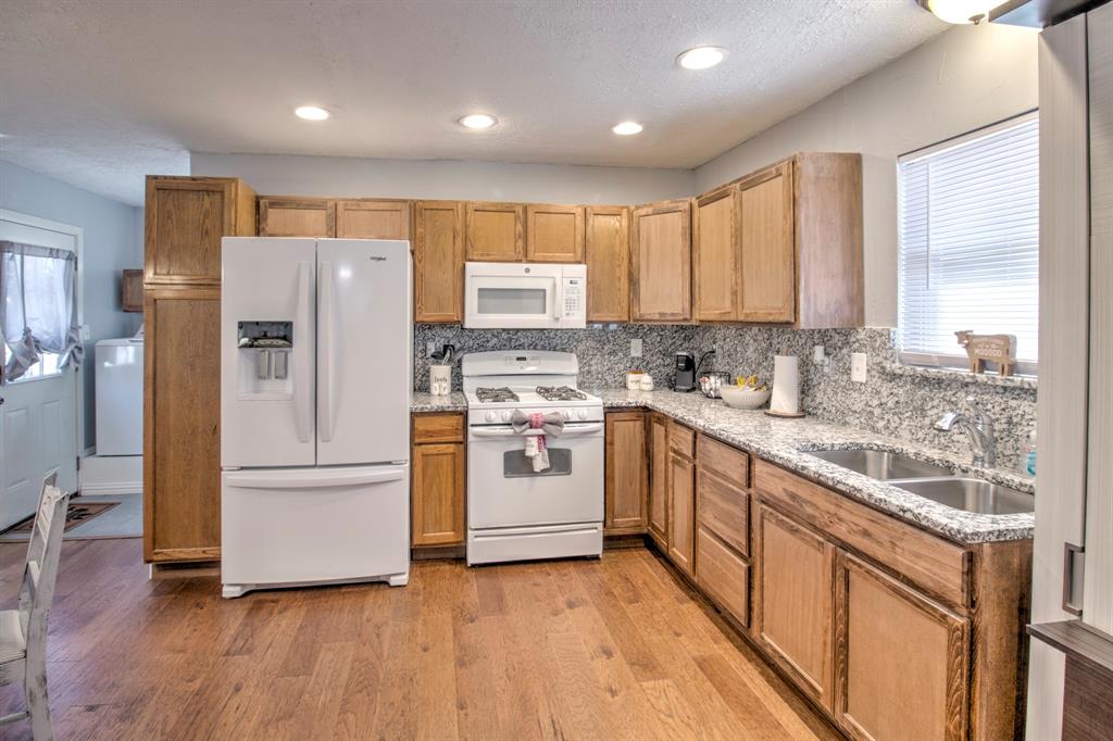 374 Hideaway Lane Valley View, TX 76272 - Photo 12 of 35 Open Kitchen with granite counter tops!