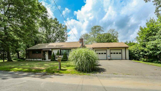 838 Woodruff Road Orange, CT 06477 - Photo 1 of 1 a front view of a house with garden