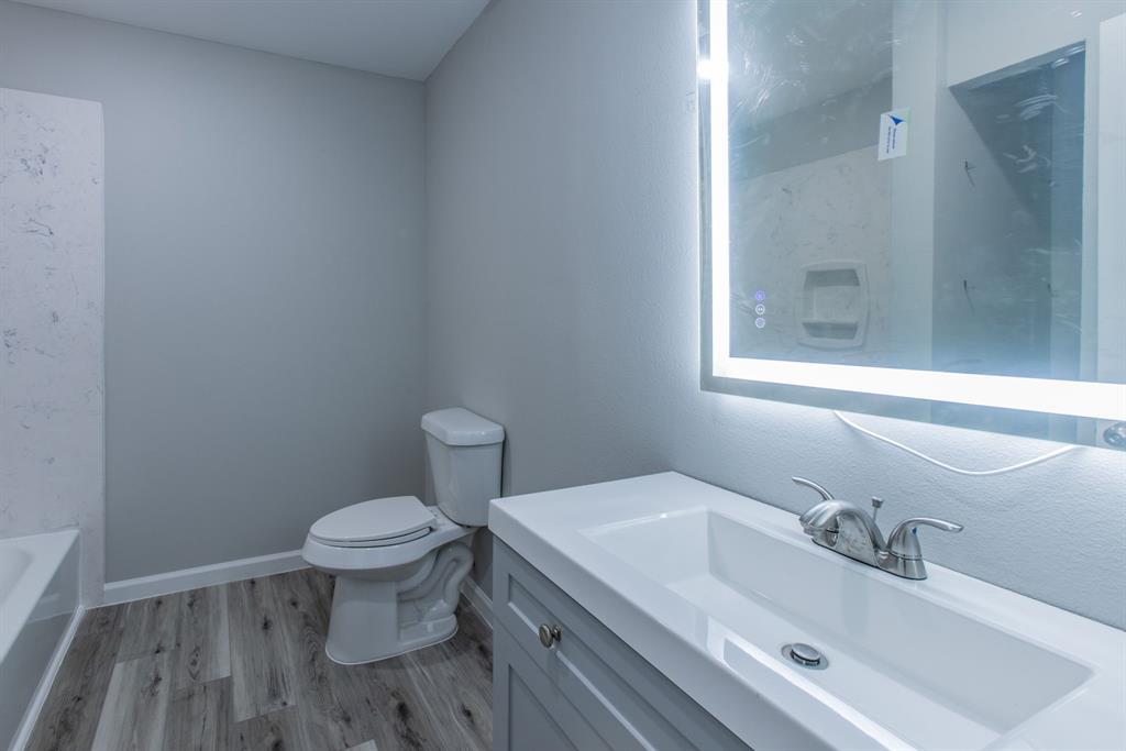 2816 Summer Avenue Waco, TX 76708 - Photo 10 of 16 a bathroom with a sink and a toilet