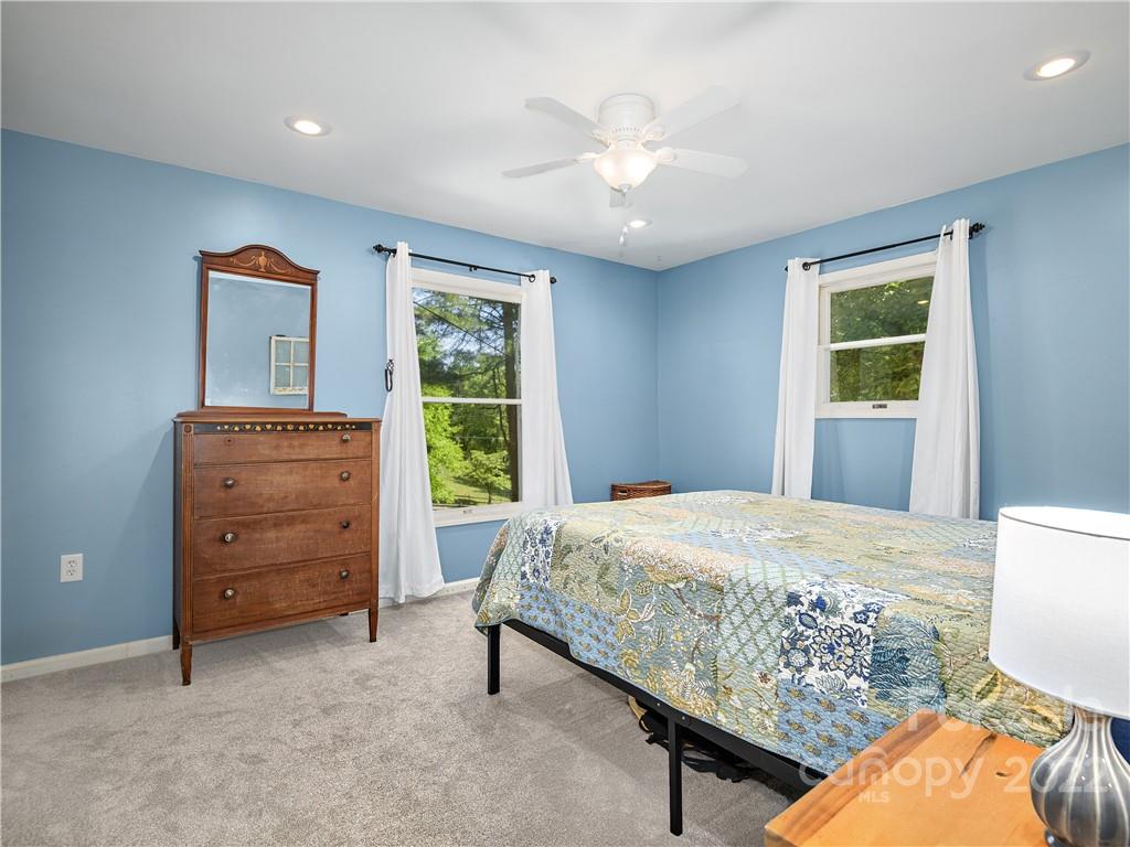 1908 Kims Cove Road Canton, NC 28716 - Photo 12 of 31 a bedroom with a bed and a dresser