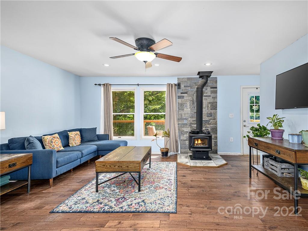 1908 Kims Cove Road Canton, NC 28716 - Photo 4 of 31 a living room with furniture and a fireplace