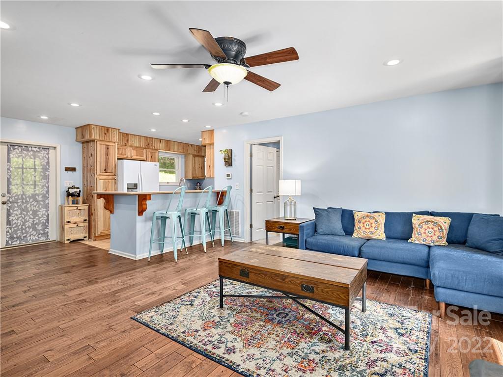 1908 Kims Cove Road Canton, NC 28716 - Photo 5 of 31 a living room with furniture and kitchen view