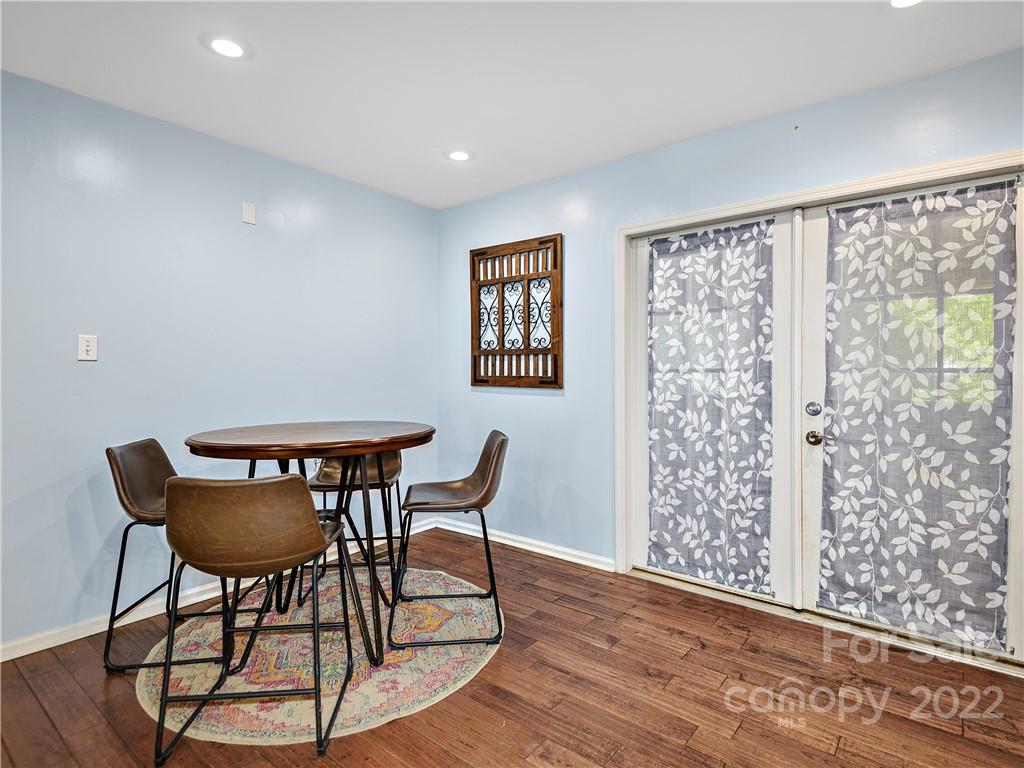 1908 Kims Cove Road Canton, NC 28716 - Photo 6 of 31 a view of a dining room with furniture and wooden floor