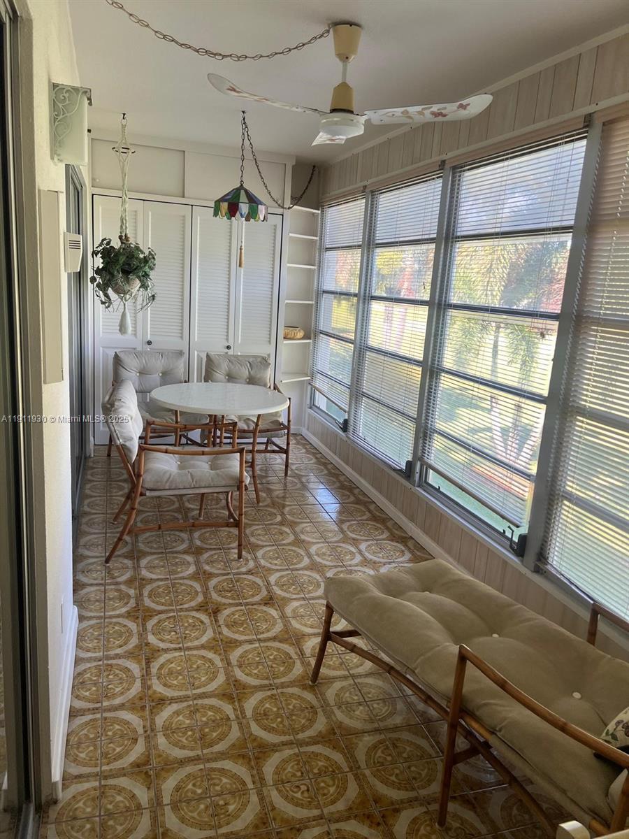 3102 Portofino Point, Unit M2 Coconut Creek, FL 33066 - Photo 12 of 26 a balcony with chairs and window
