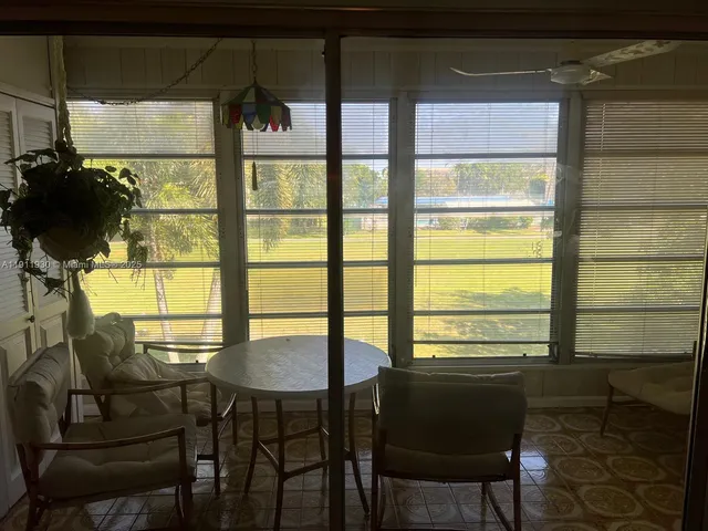 a bed room with a bed furniture and a window