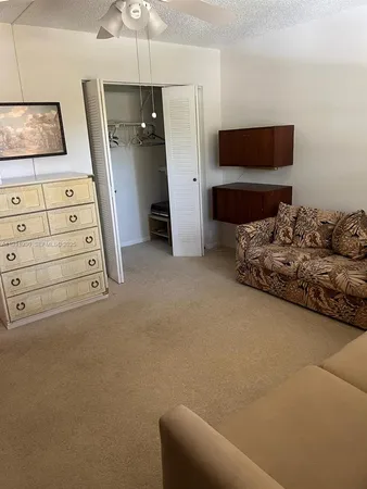 a view of livingroom with furniture and flat screen tv