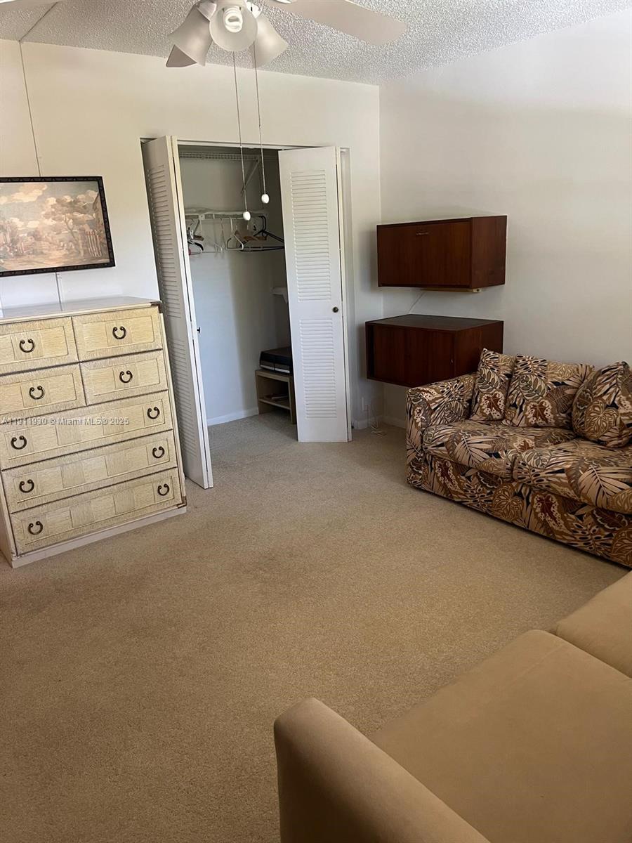 3102 Portofino Point, Unit M2 Coconut Creek, FL 33066 - Photo 26 of 26 a view of livingroom with furniture and flat screen tv