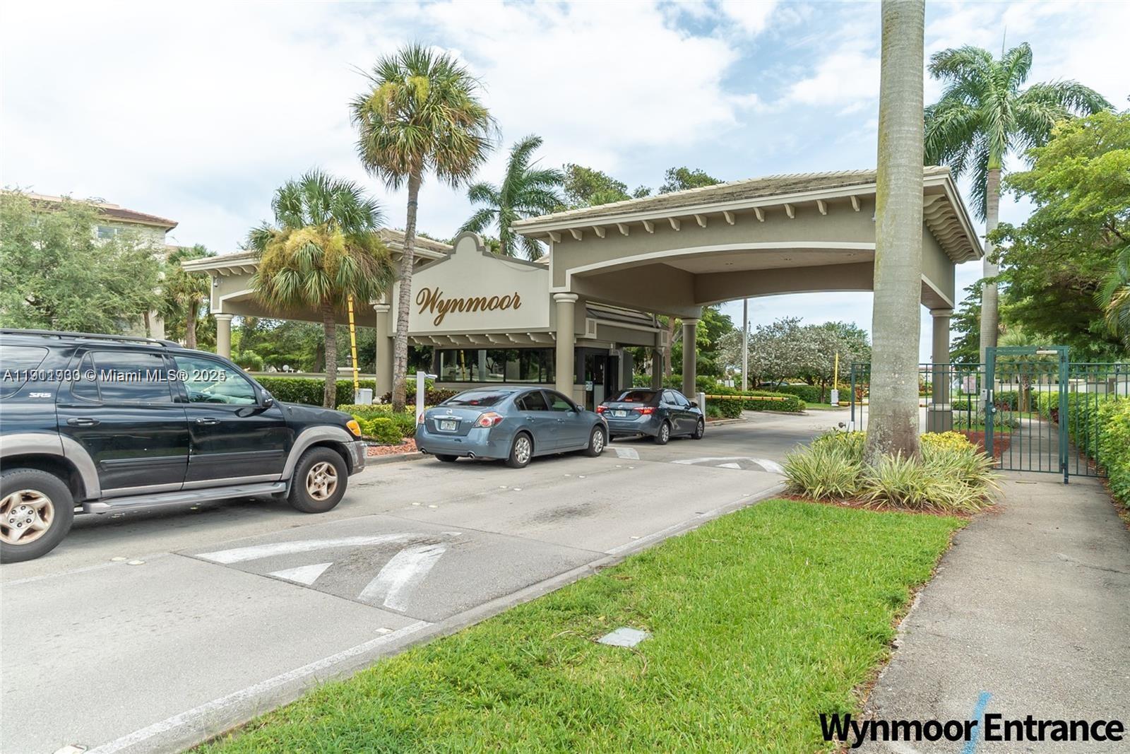3102 Portofino Point, Unit M2 Coconut Creek, FL 33066 - Photo 5 of 26 a view of a car parked in front of a building