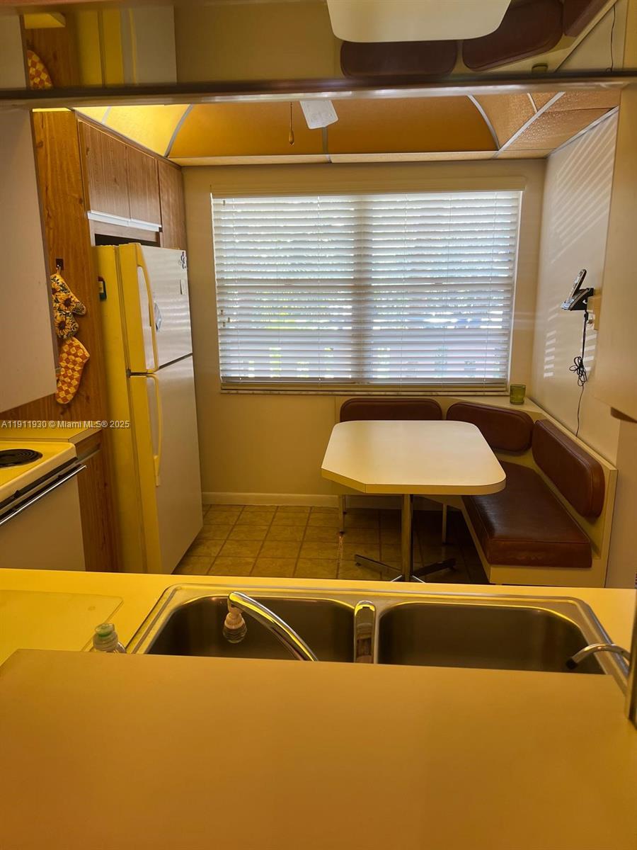 3102 Portofino Point, Unit M2 Coconut Creek, FL 33066 - Photo 9 of 26 a bathroom with a sink and a shower