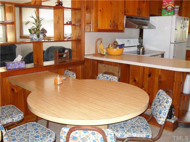 1612 Sherron Road Durham, NC 27703 - Photo 7 of 14 Built in table in the breakfast nook. This table can be removed. Also has a breakfast bar.