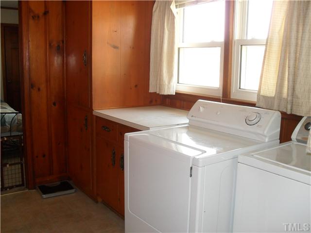1612 Sherron Road Durham, NC 27703 - Photo 9 of 14 Nice size Laundry room with storage and a place to fold your clothes.