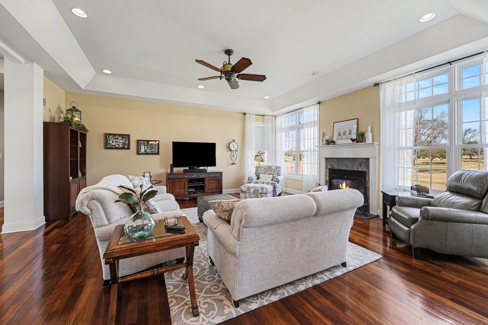 1744 East Offner Road Beecher, IL 60401 - Photo 12 of 49 a living room with furniture fireplace and a flat screen tv