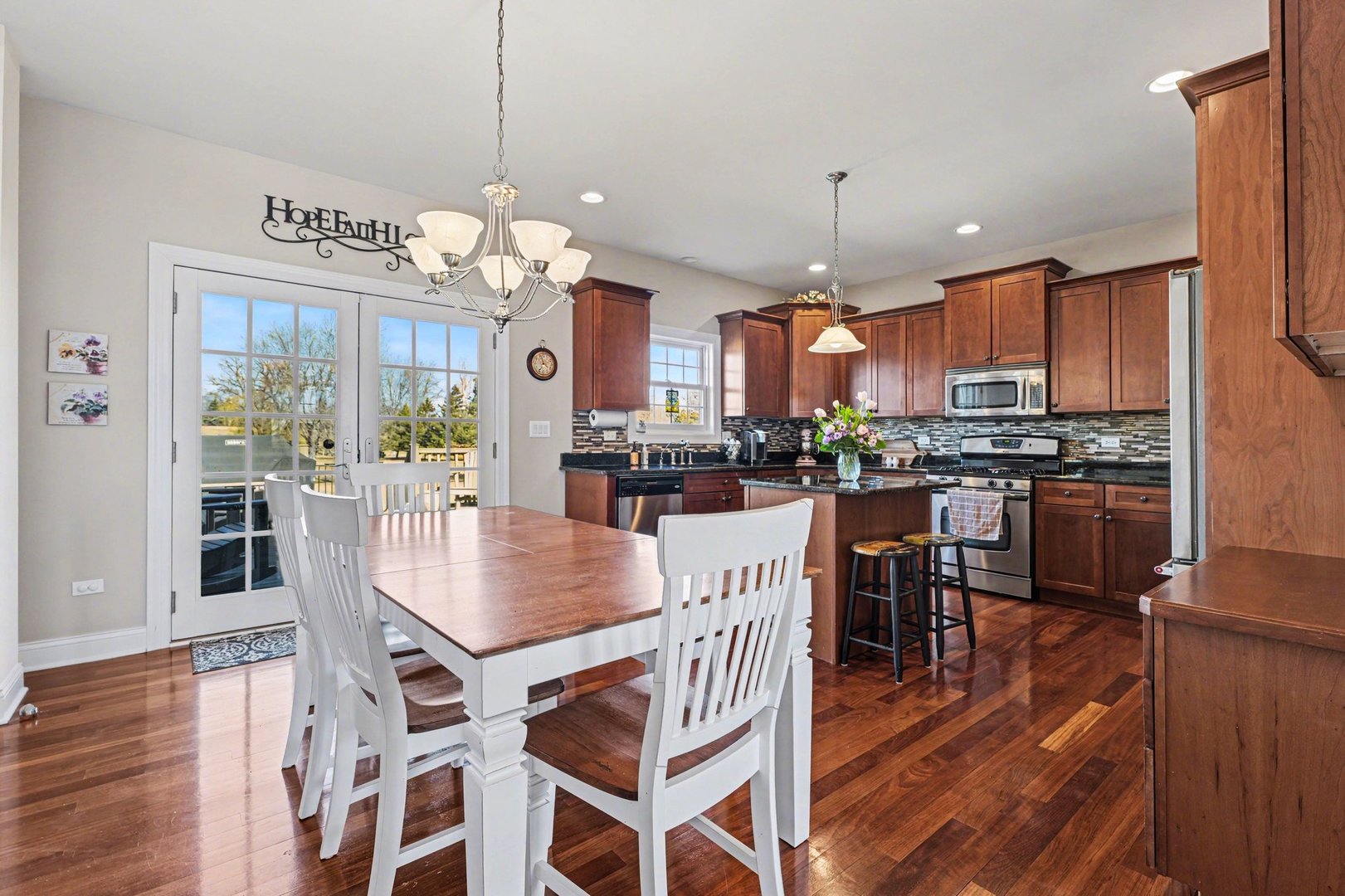 1744 East Offner Road Beecher, IL 60401 - Photo 14 of 49 a view of a dining room with furniture window and wooden floor