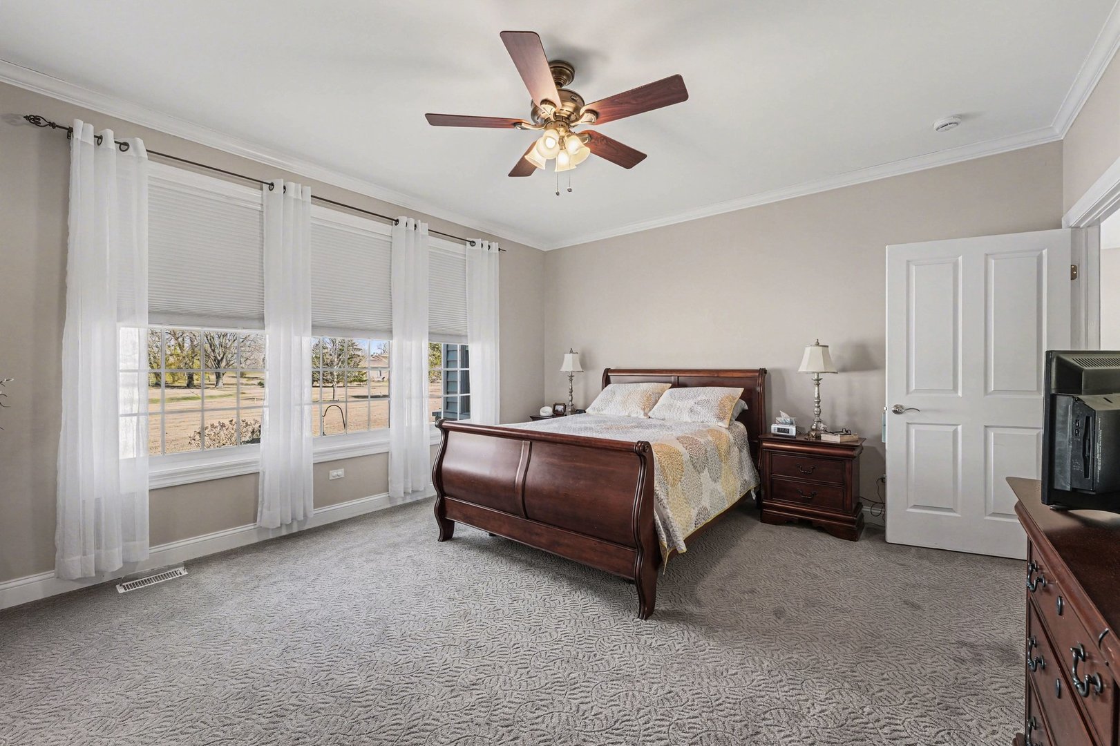 1744 East Offner Road Beecher, IL 60401 - Photo 18 of 49 a spacious bedroom with a bed and a large window