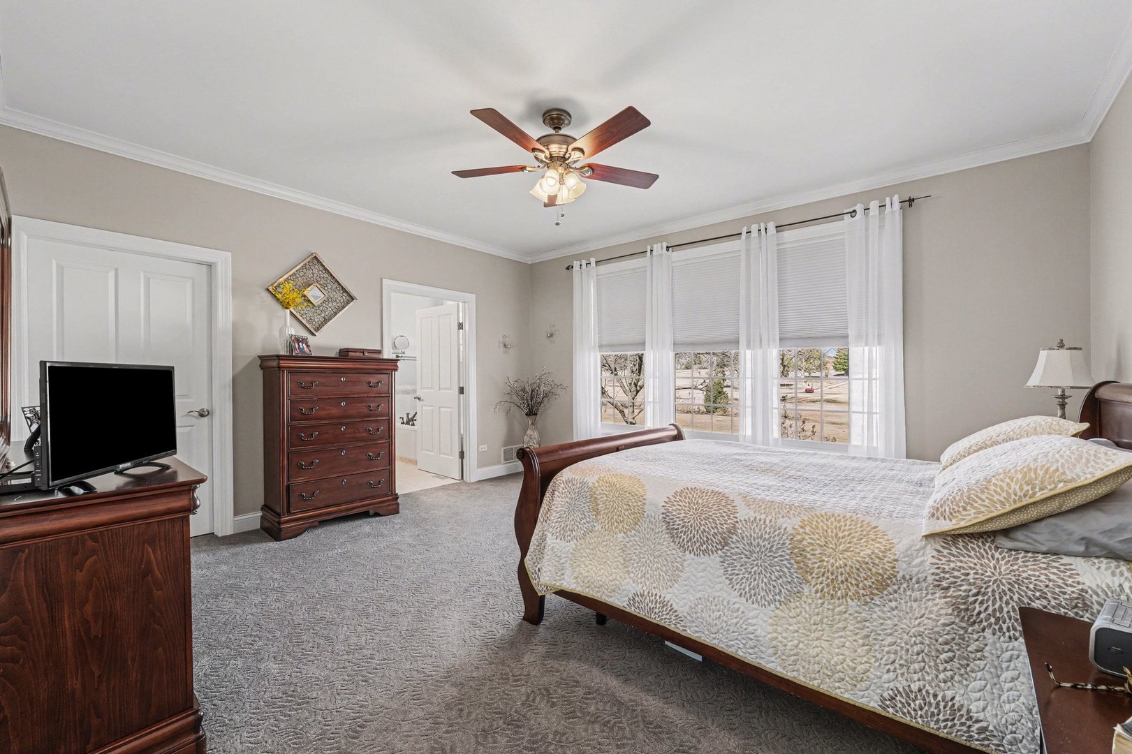 1744 East Offner Road Beecher, IL 60401 - Photo 19 of 49 a bed sitting in a spacious bedroom next to a window