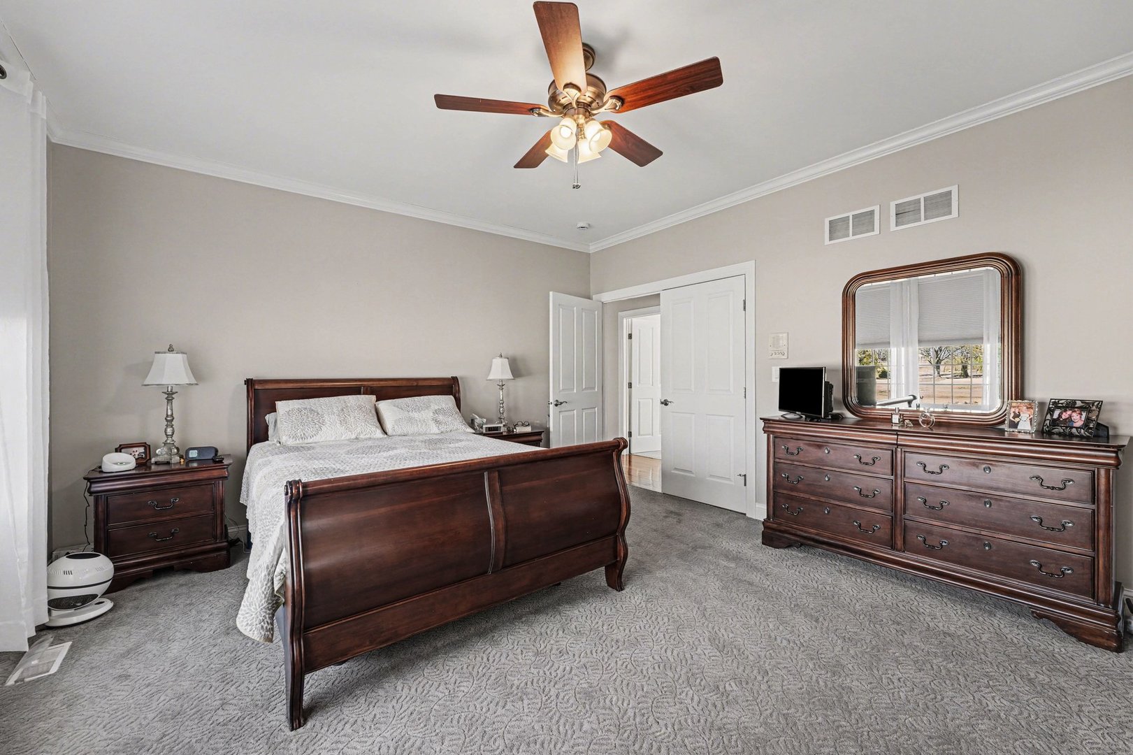 1744 East Offner Road Beecher, IL 60401 - Photo 20 of 49 a room with a bed and a mirror on dresser