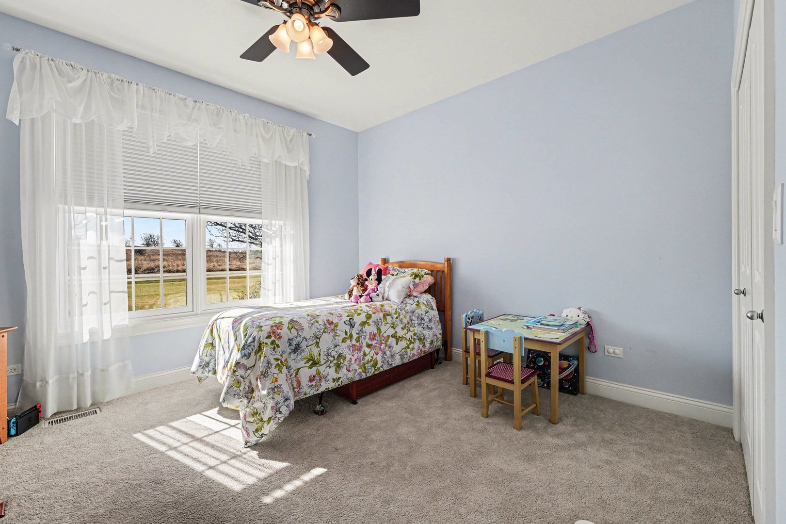 1744 East Offner Road Beecher, IL 60401 - Photo 23 of 49 a bedroom with a bed and a chandelier