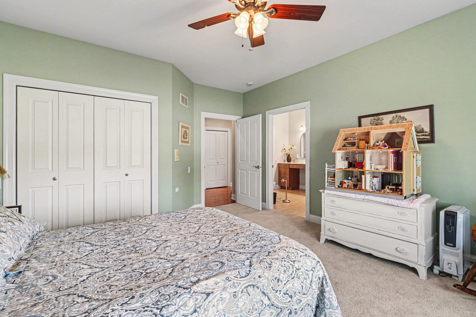1744 East Offner Road Beecher, IL 60401 - Photo 28 of 49 a bedroom with a large bed and a chandelier