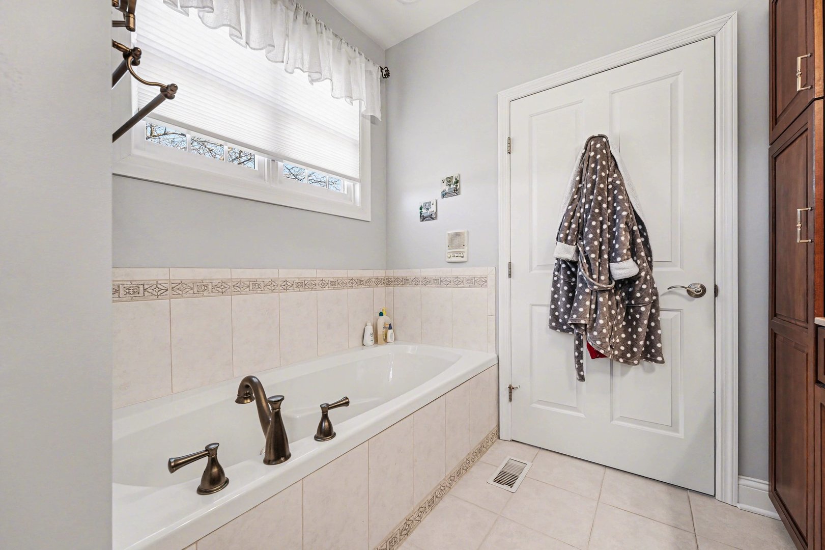 1744 East Offner Road Beecher, IL 60401 - Photo 31 of 49 a bathroom with a bathtub and shower