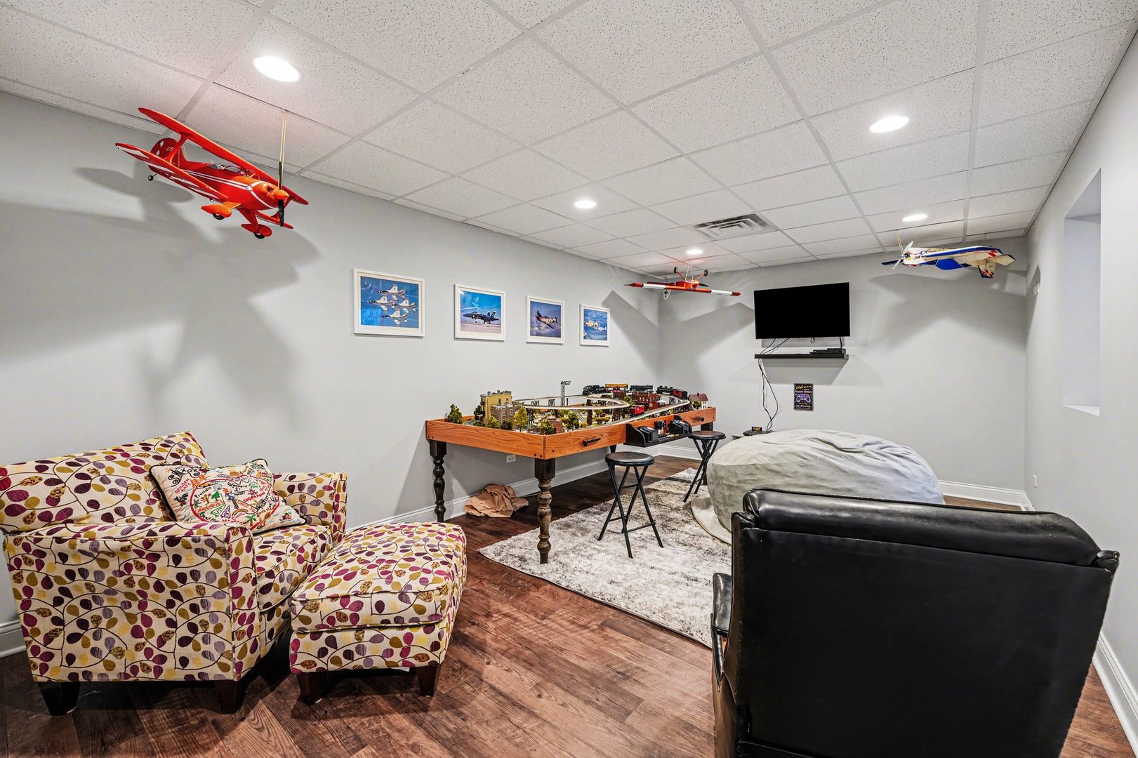 1744 East Offner Road Beecher, IL 60401 - Photo 39 of 49 a bedroom with furniture and a flat screen tv