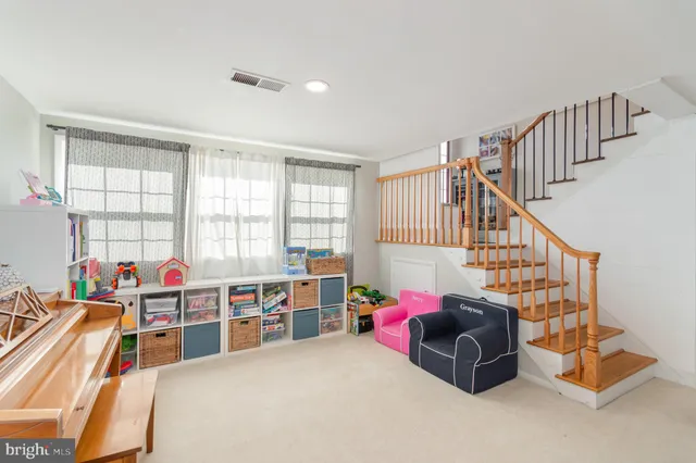 a view of a house with a yard covered in snow