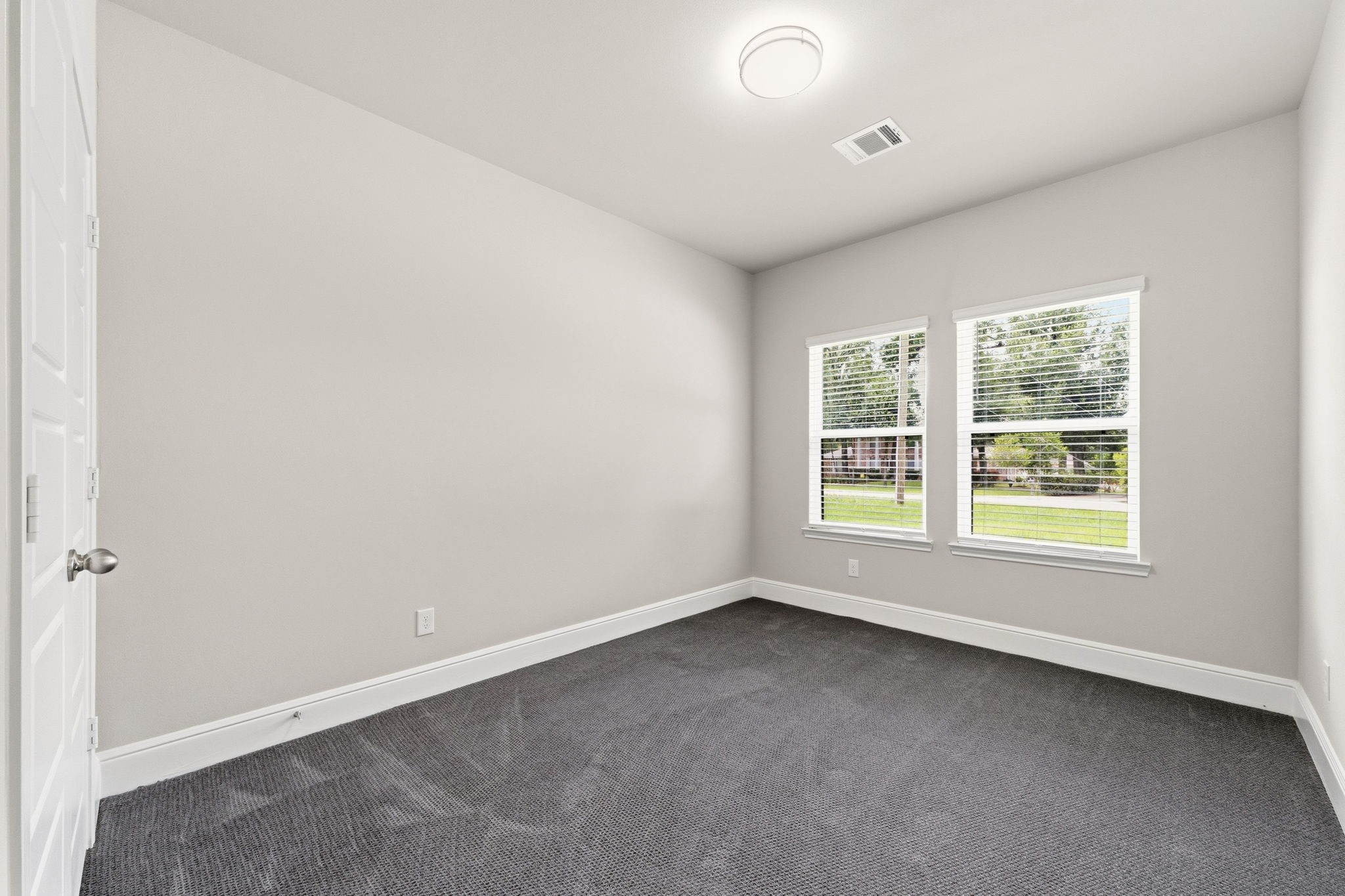 23620 Youpon Lane Spring, TX 77389 - Photo 25 of 37 Spacious secondary bedrooms feature lots of natural light and carpet for added comfort.