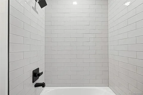 a view of hallway with stairs and wooden floor