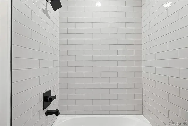 a view of hallway with stairs and wooden floor