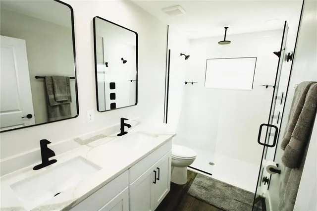 a room with pool table and ceiling fan