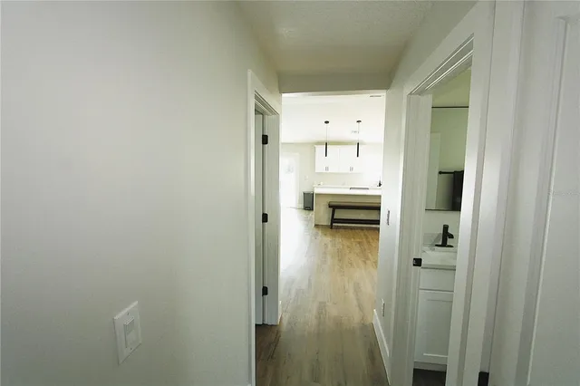 a bedroom with a bed and a ceiling fan