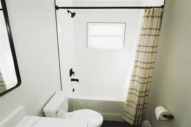 a view of hallway with wooden floor