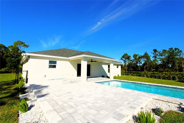 a house with trees in the background