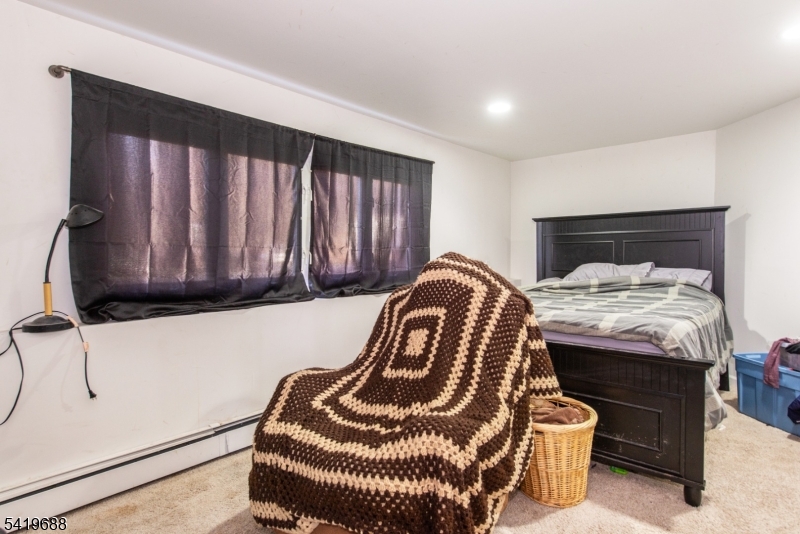 127 Horseneck Road Fairfield, NJ 07004 - Photo 19 of 34 a bedroom with a bed and dresser