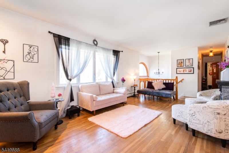 127 Horseneck Road Fairfield, NJ 07004 - Photo 4 of 34 a living room with furniture and a window