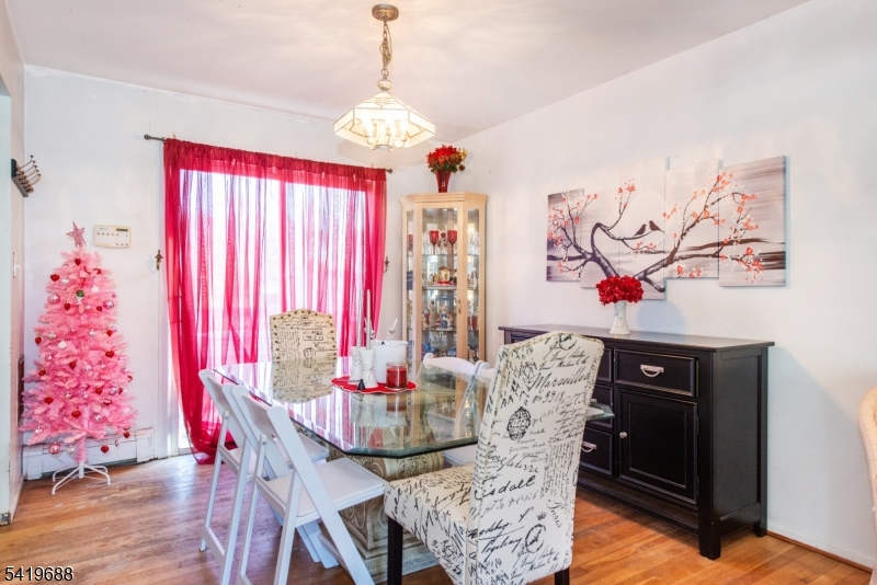 127 Horseneck Road Fairfield, NJ 07004 - Photo 6 of 34 a view of a dining room with furniture and chandelier