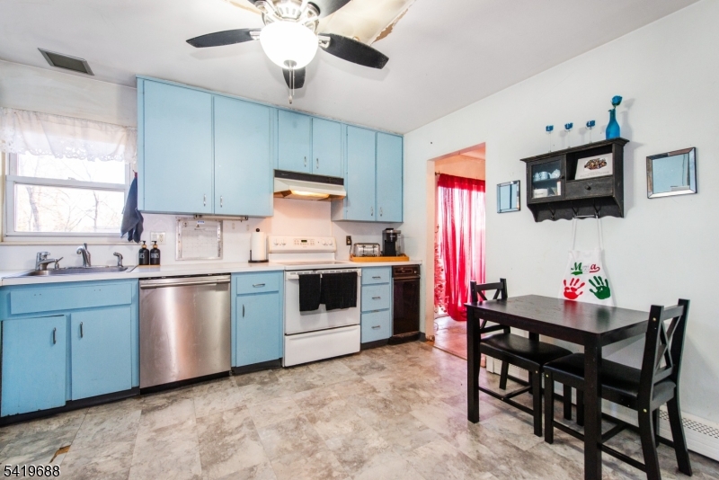 127 Horseneck Road Fairfield, NJ 07004 - Photo 9 of 34 a kitchen that has a cabinets counter space and appliances