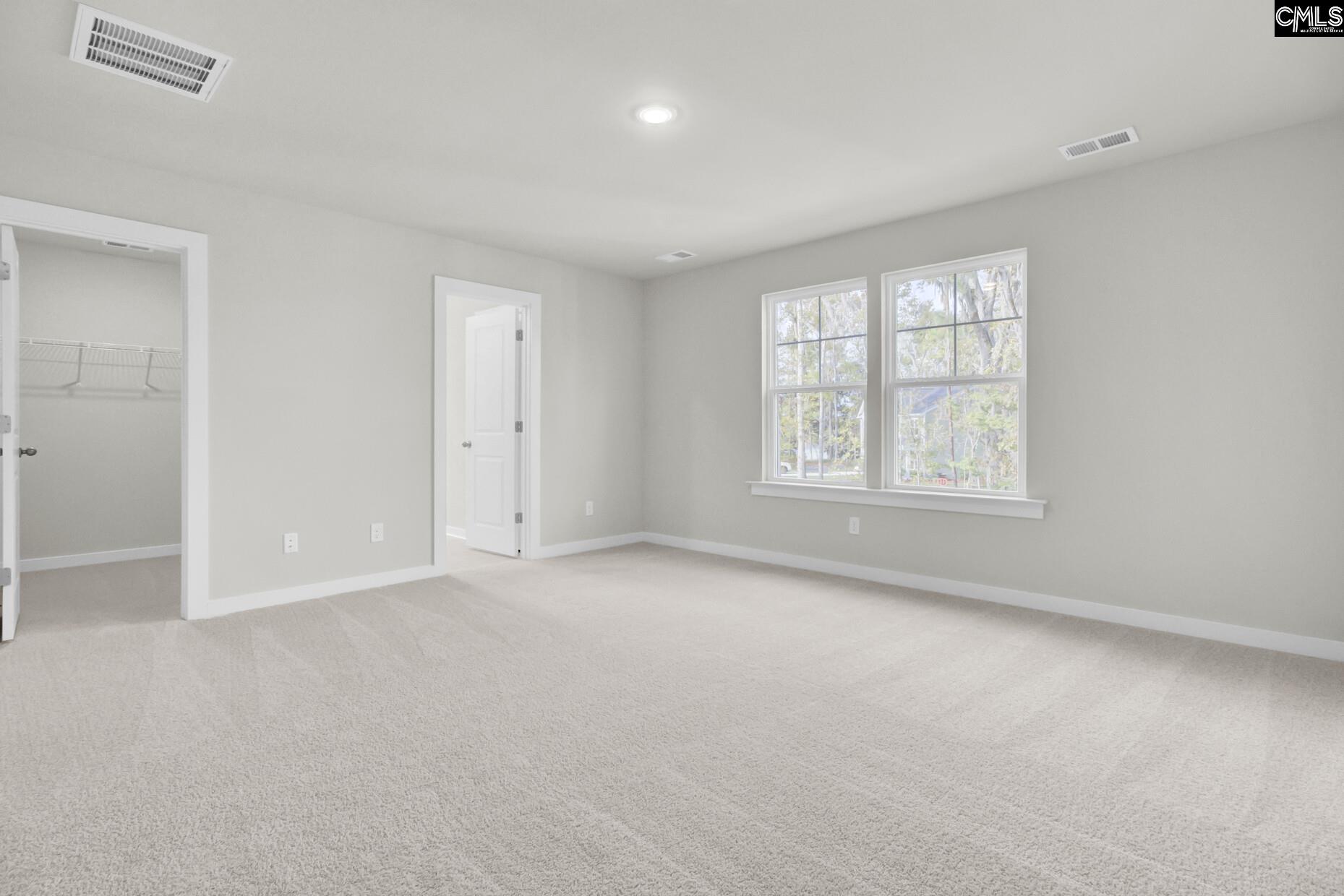 320 Brass Billion Path Lexington, SC 29073 - Photo 3 of 39 an empty room with windows and closet