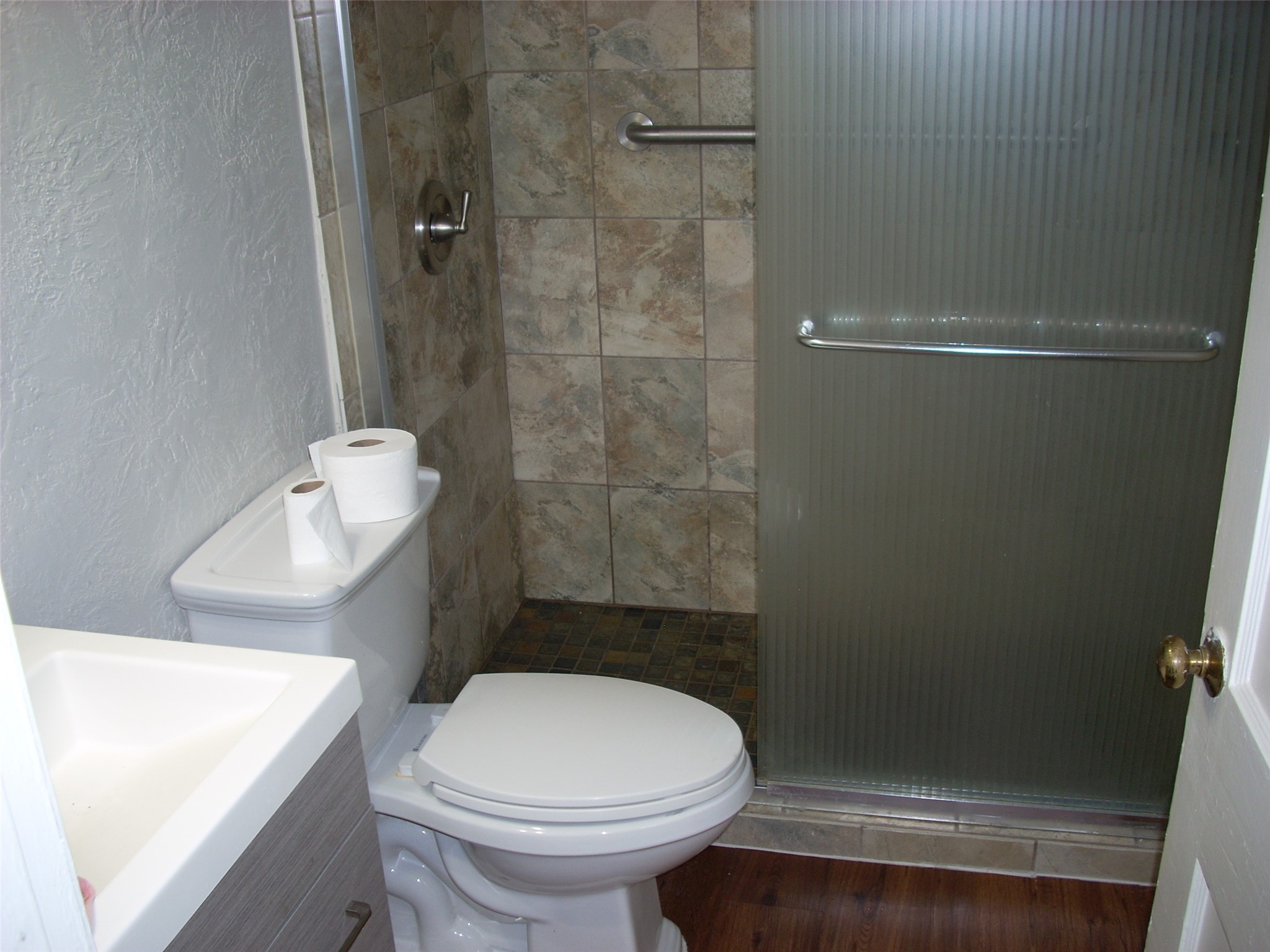 6927 Keller Street Houston, TX 77087 - Photo 9 of 11 a bathroom with a sink a toilet and shower