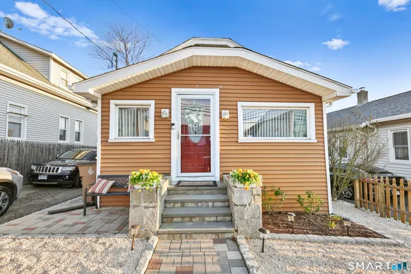 a front view of a house with a porch