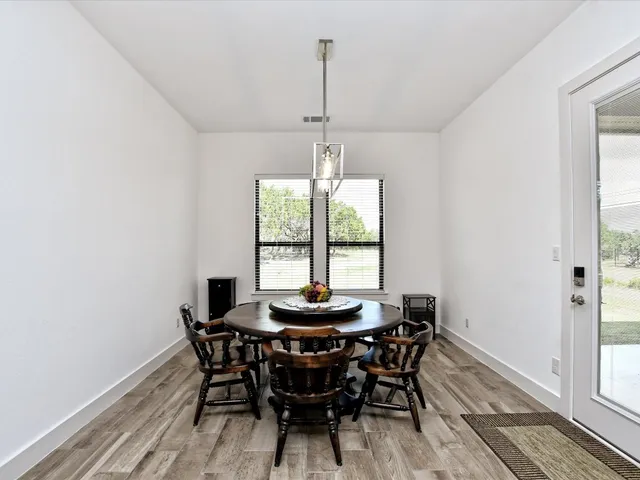 a dining room with furniture and window