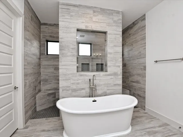 a white bath tub sitting in a bathroom