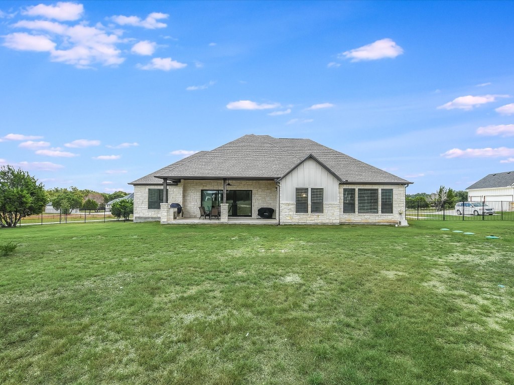 113 Tesoro Perdido Cove Liberty Hill, TX 78642 - Photo 30 of 31 a front view of a house with a garden