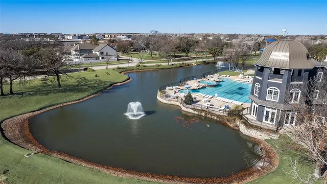 an aerial view of a residential houses with outdoor space