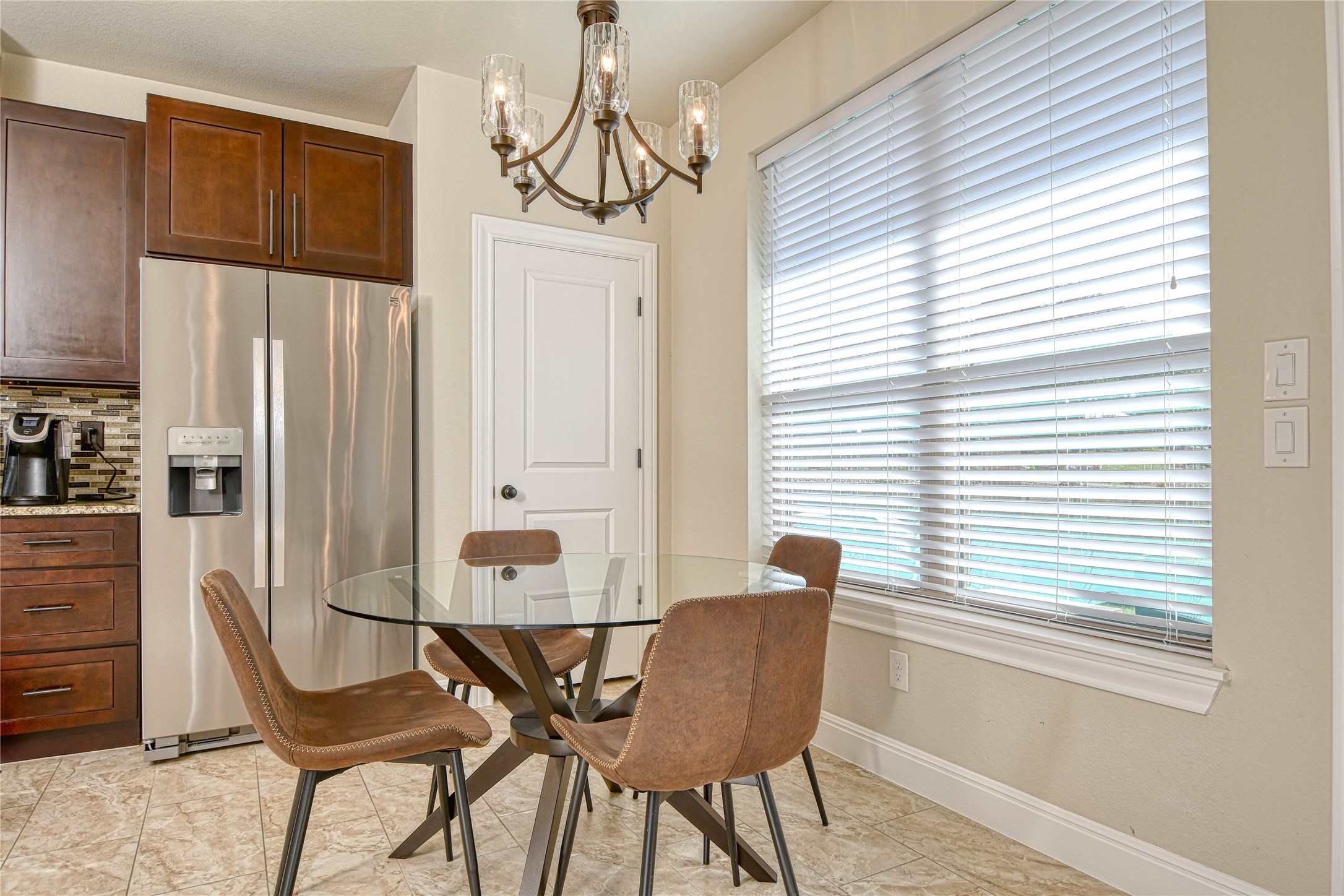 565 Demarett Drive Point Venture, TX 78645 - Photo 7 of 46 a view of a dining room with furniture and window