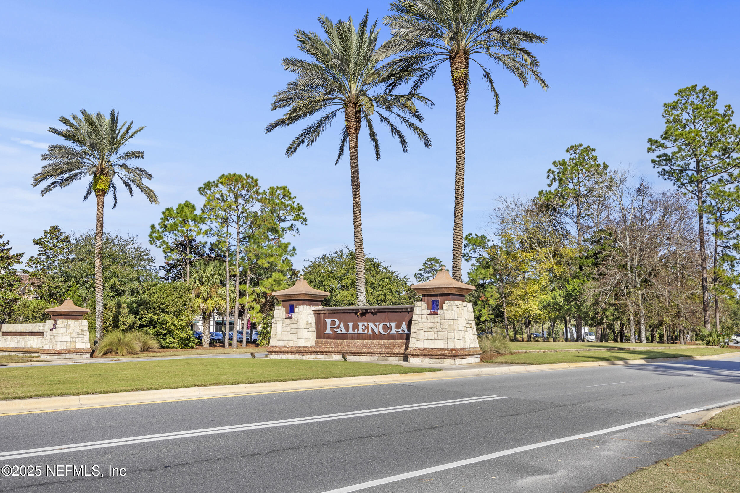 210 Paseo Terraza, Unit 301 St. Augustine, FL 32095 - Photo 2 of 54 a front view of a house with swimming pool and trees
