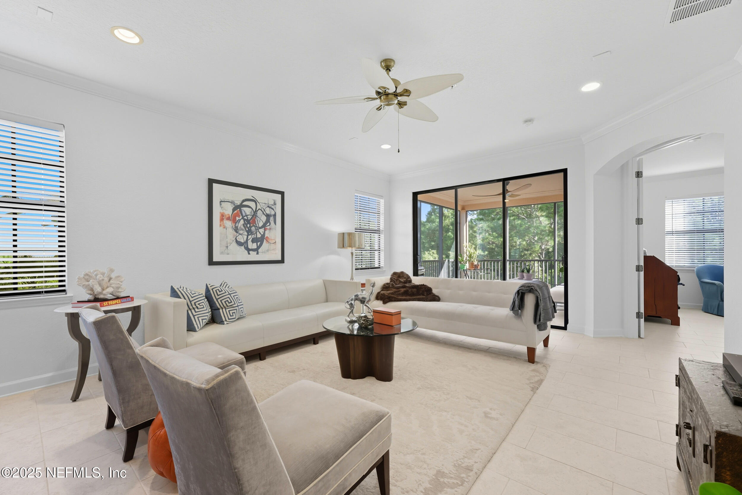 210 Paseo Terraza, Unit 301 St. Augustine, FL 32095 - Photo 21 of 54 a living room with furniture and a large window