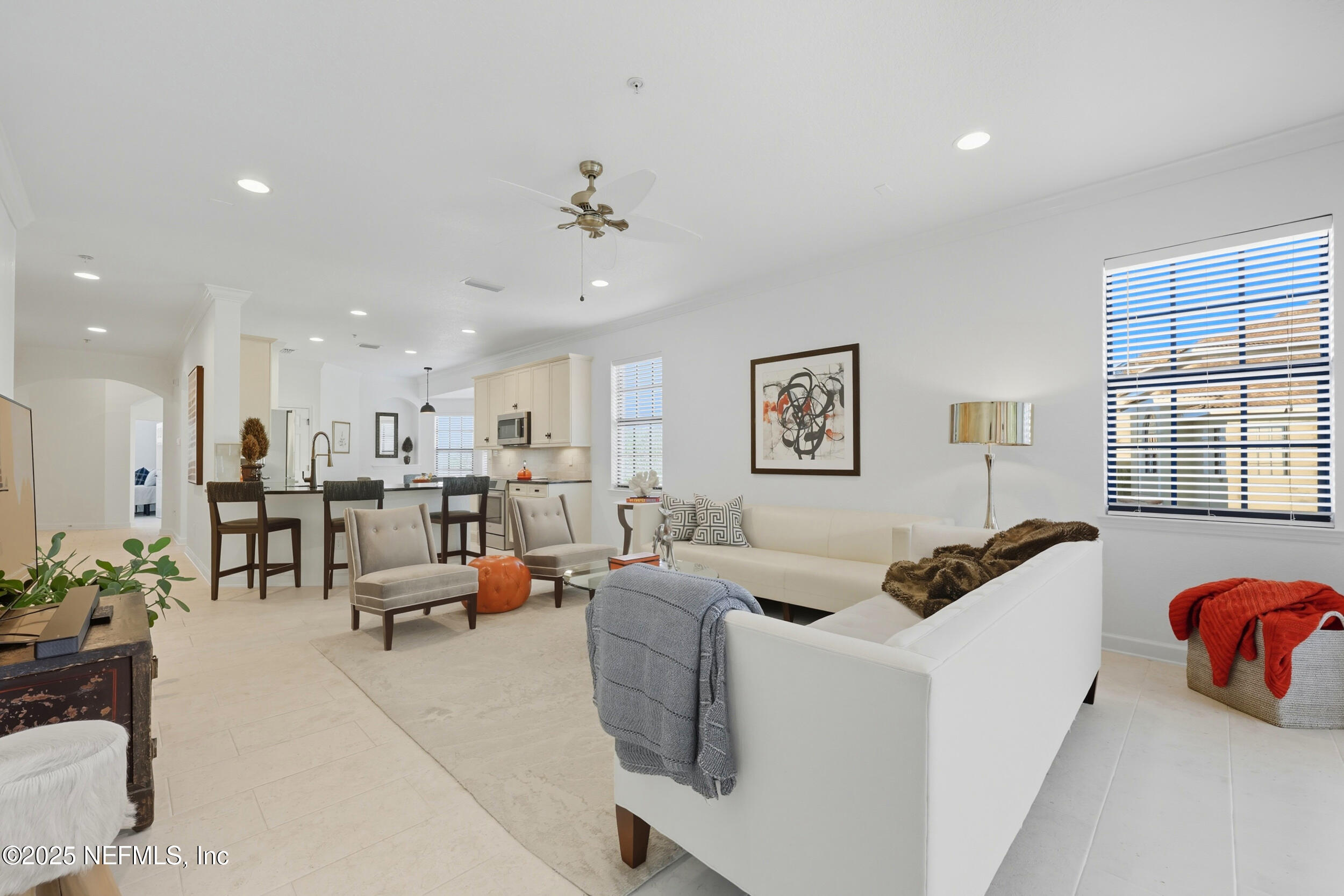 210 Paseo Terraza, Unit 301 St. Augustine, FL 32095 - Photo 22 of 54 a living room with furniture and a large window