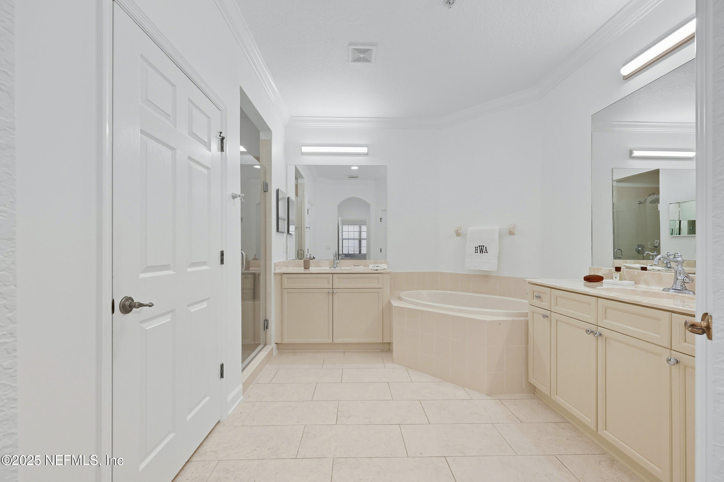 210 Paseo Terraza, Unit 301 St. Augustine, FL 32095 - Photo 25 of 54 a bathroom with a tub sink and mirror
