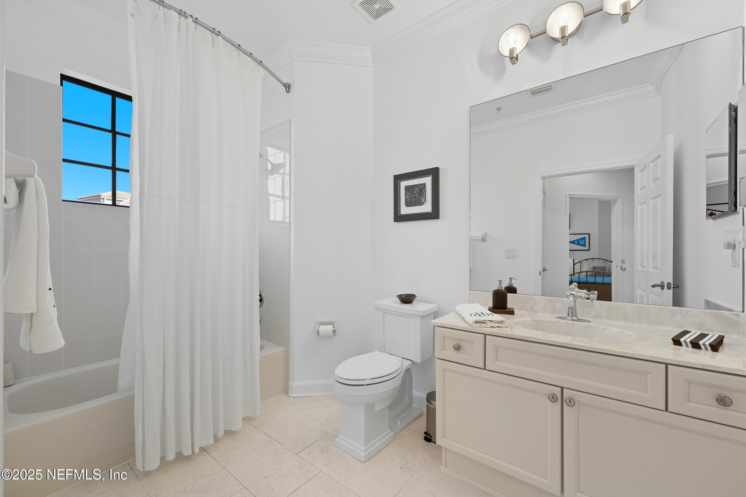 210 Paseo Terraza, Unit 301 St. Augustine, FL 32095 - Photo 30 of 54 a bathroom with a toilet a sink and a mirror